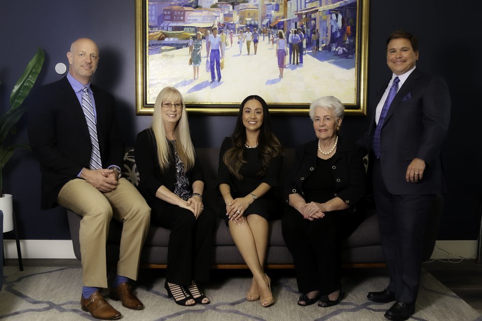 The full team seated in the office lounge, left to right: Douglas F. Dieker, Cindy Lockwood, Monica Peraza, Carol Cook and S. Christopher Copple